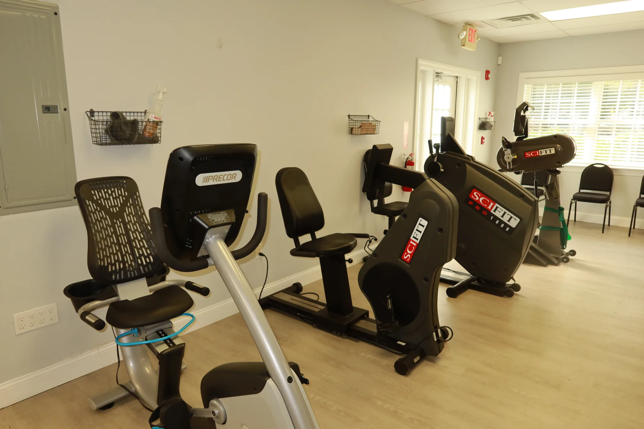 Cardio room with recumbent bikes and upper body ergometers
