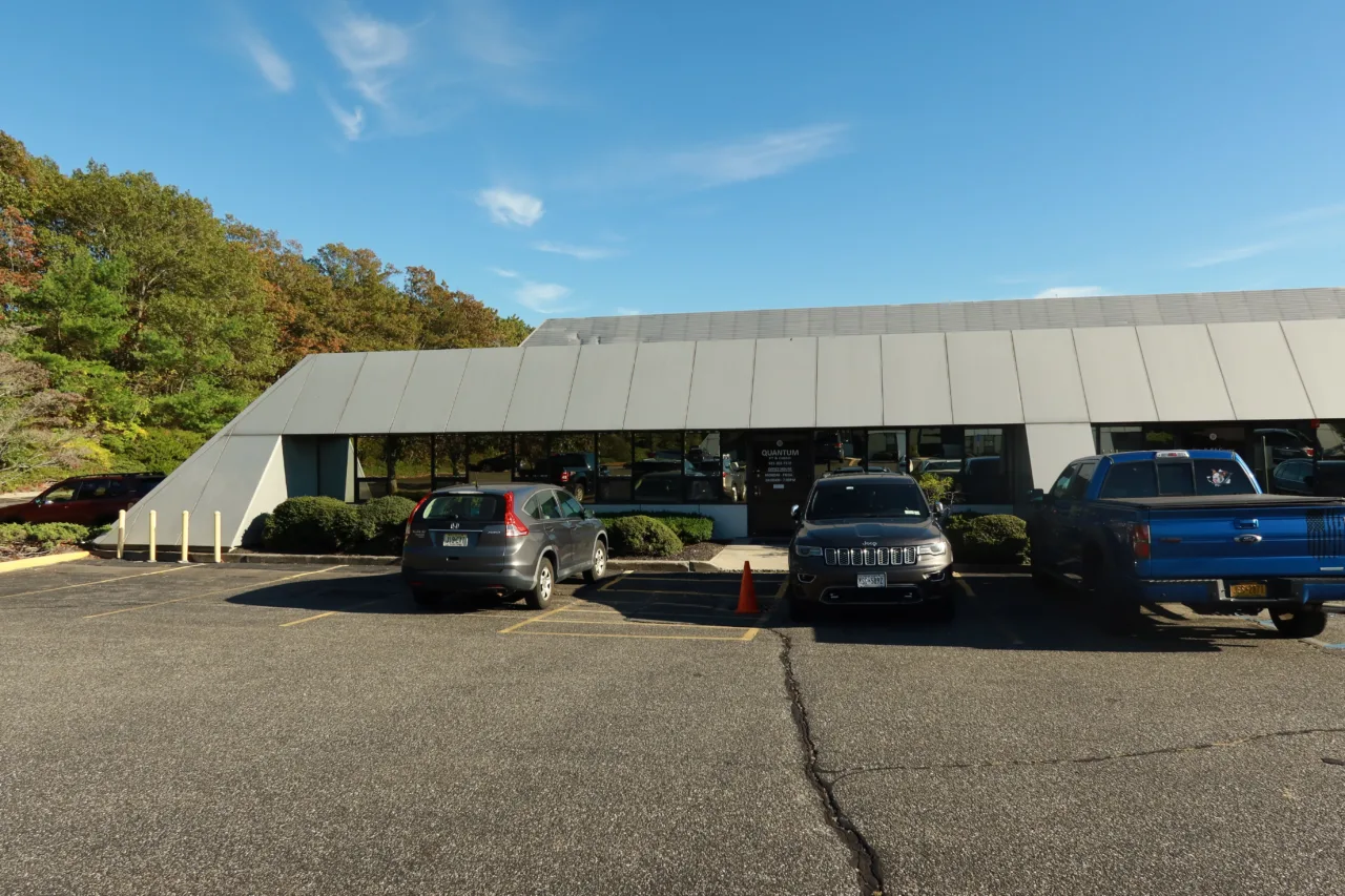 Exterior of the Hauppauge office, a low building with parking in front