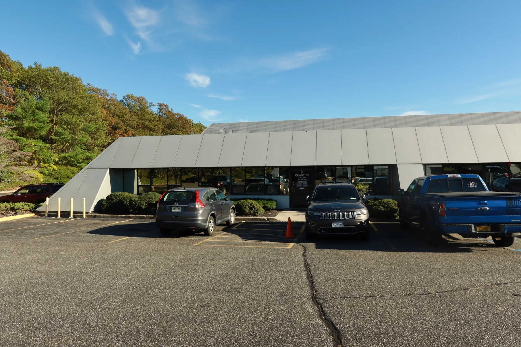 Exterior of the Hauppauge office, a low building with parking in front