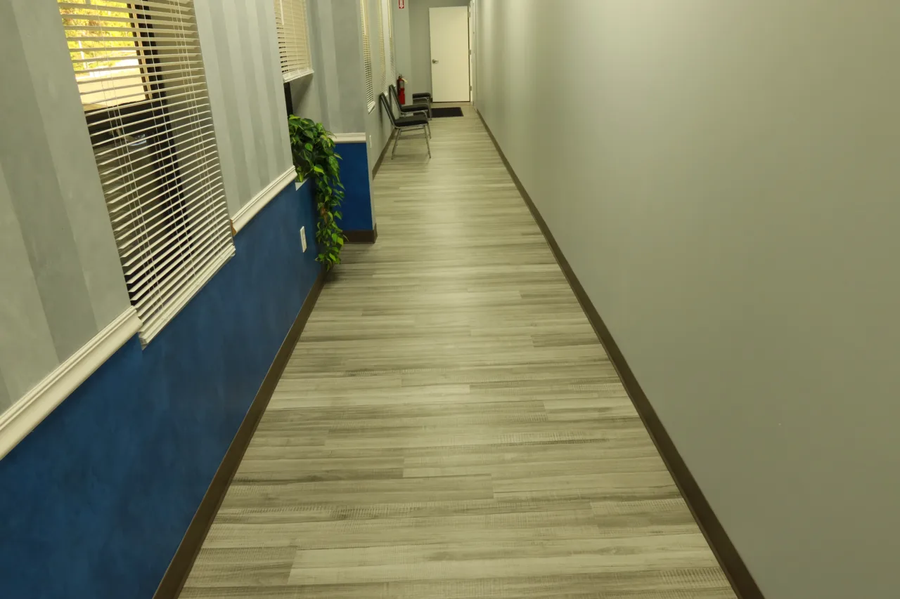 Corridor running past the waiting area to the treatment rooms